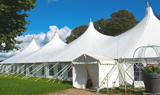 a line of sleek and modern portable restrooms ready for use at an upscale corporate event in Burlington